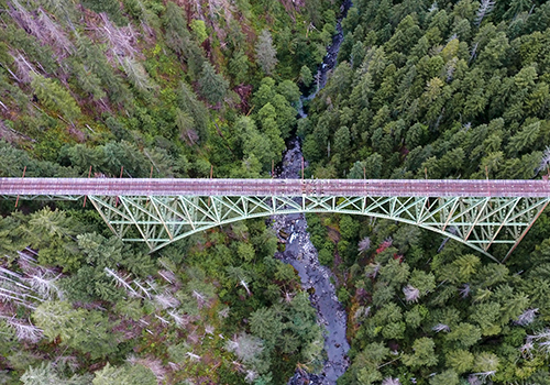 Aerial view of bridge over river in a canyon