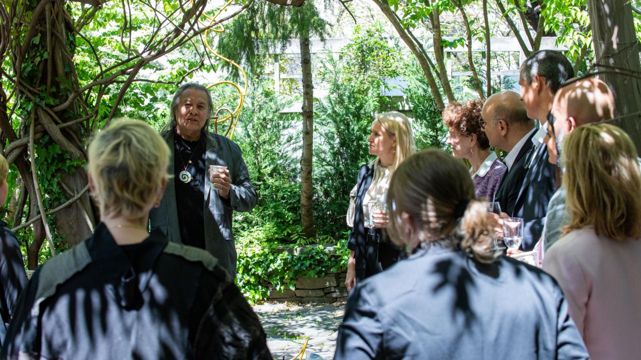 people in circle in garden